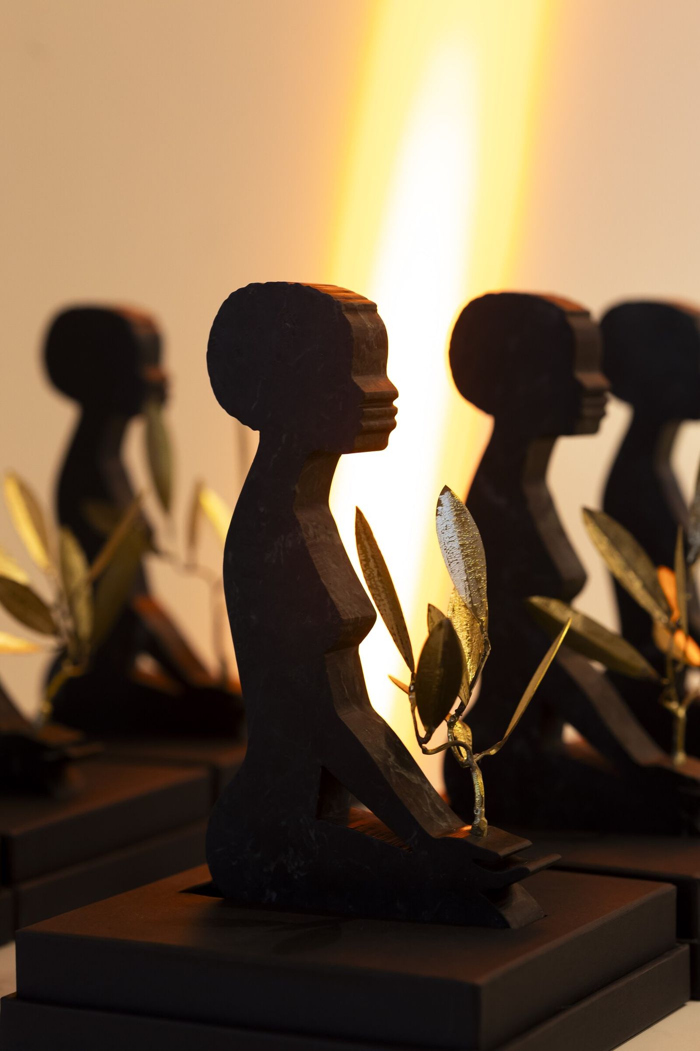 The «Calling for Peace» awards lined up, backlit, at UNESCO Headquarters in Paris on 21 September 2026
