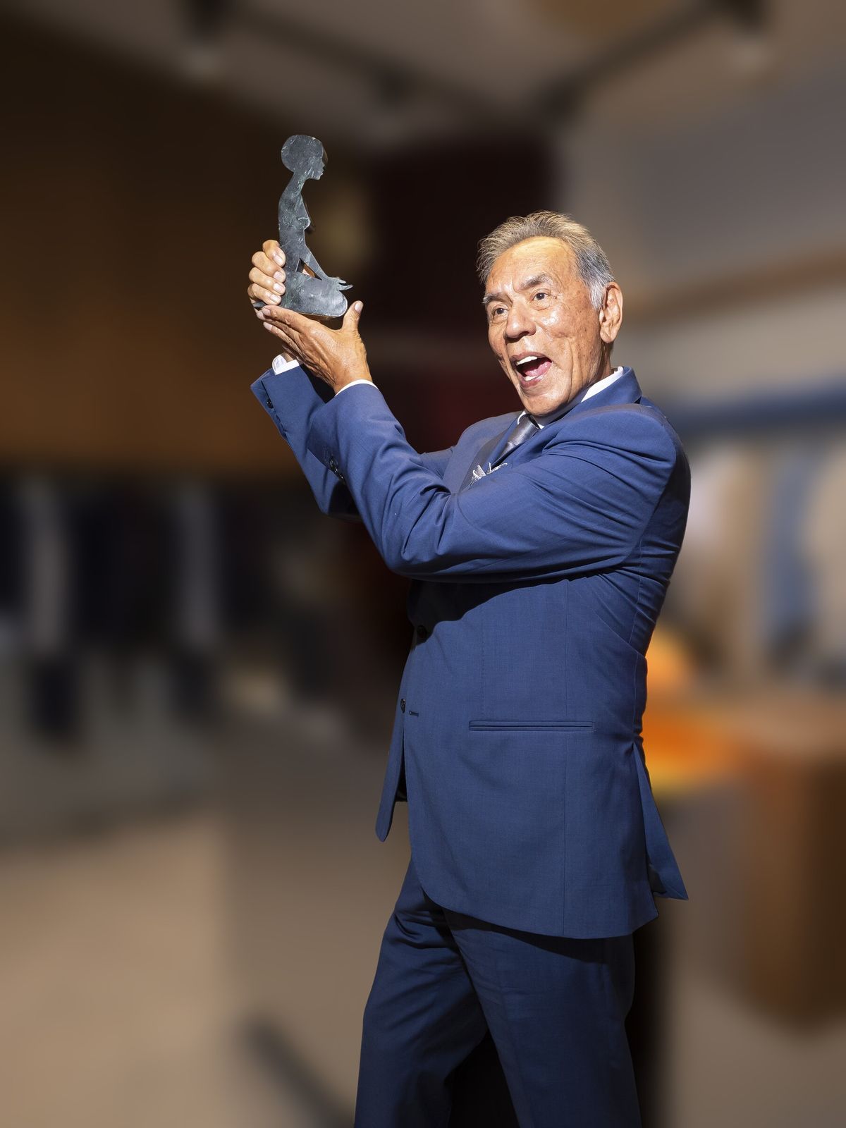 Wes Studi raises the AFG Award